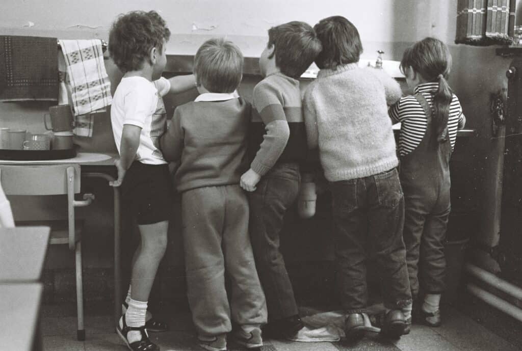 group of young kids in classroom, black and white