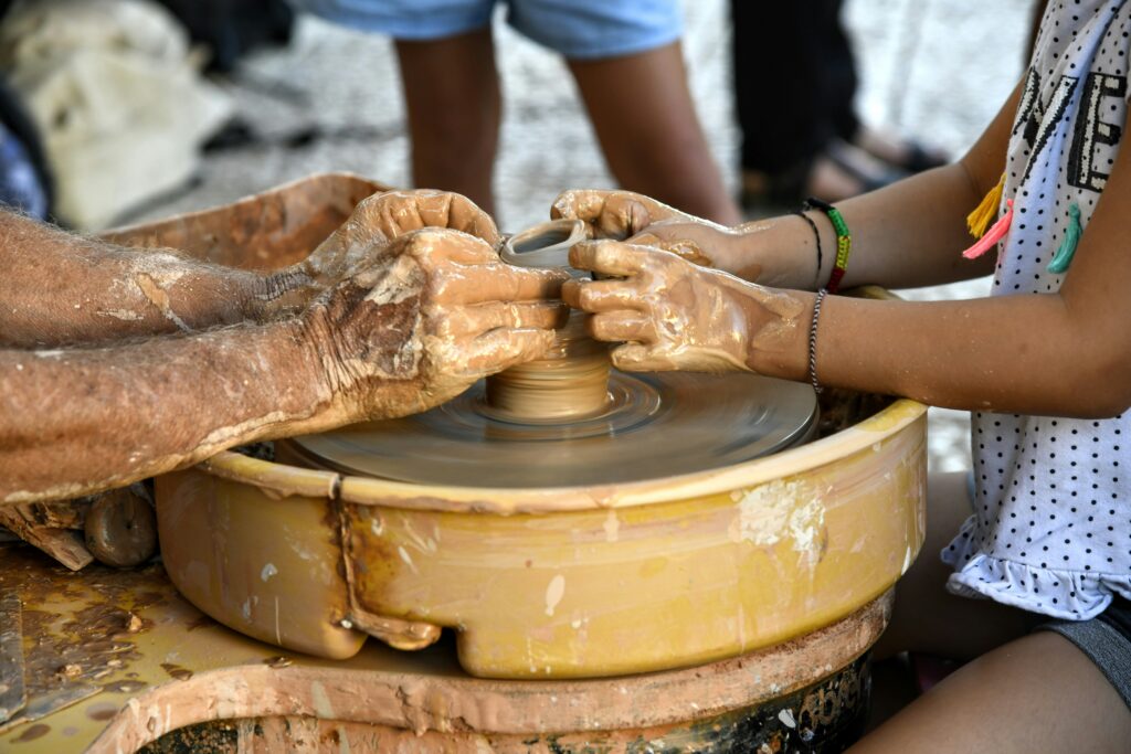group of students pursuing their passions of pottery
